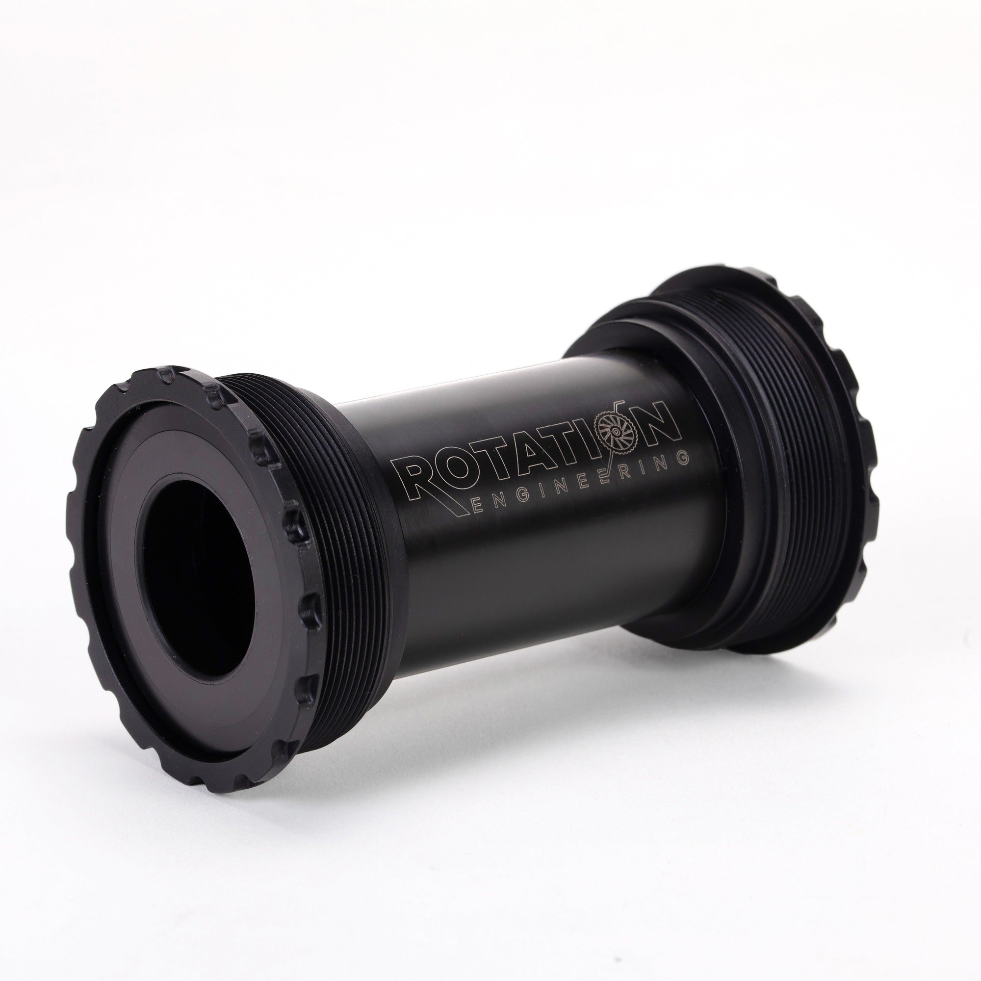 Close-up of a black cylindrical mechanical part, labeled "Rotation Engineering." It has threaded ends, a smooth surface, and exudes a sleek, industrial look.