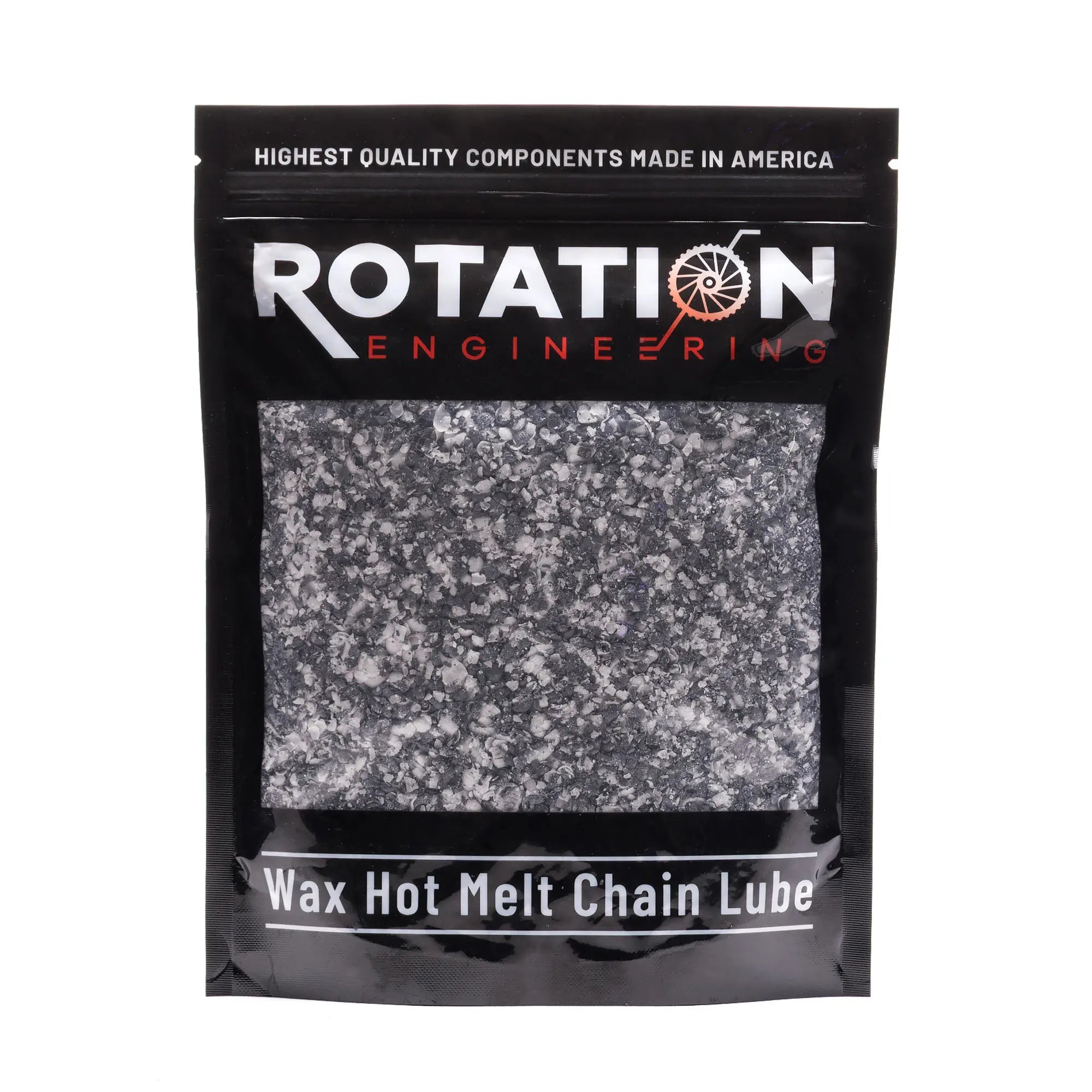 Black pouch labeled "Rotation Engineering" containing wax hot melt chain lube. The pouch displays white granular contents. Industrial and professional tone.