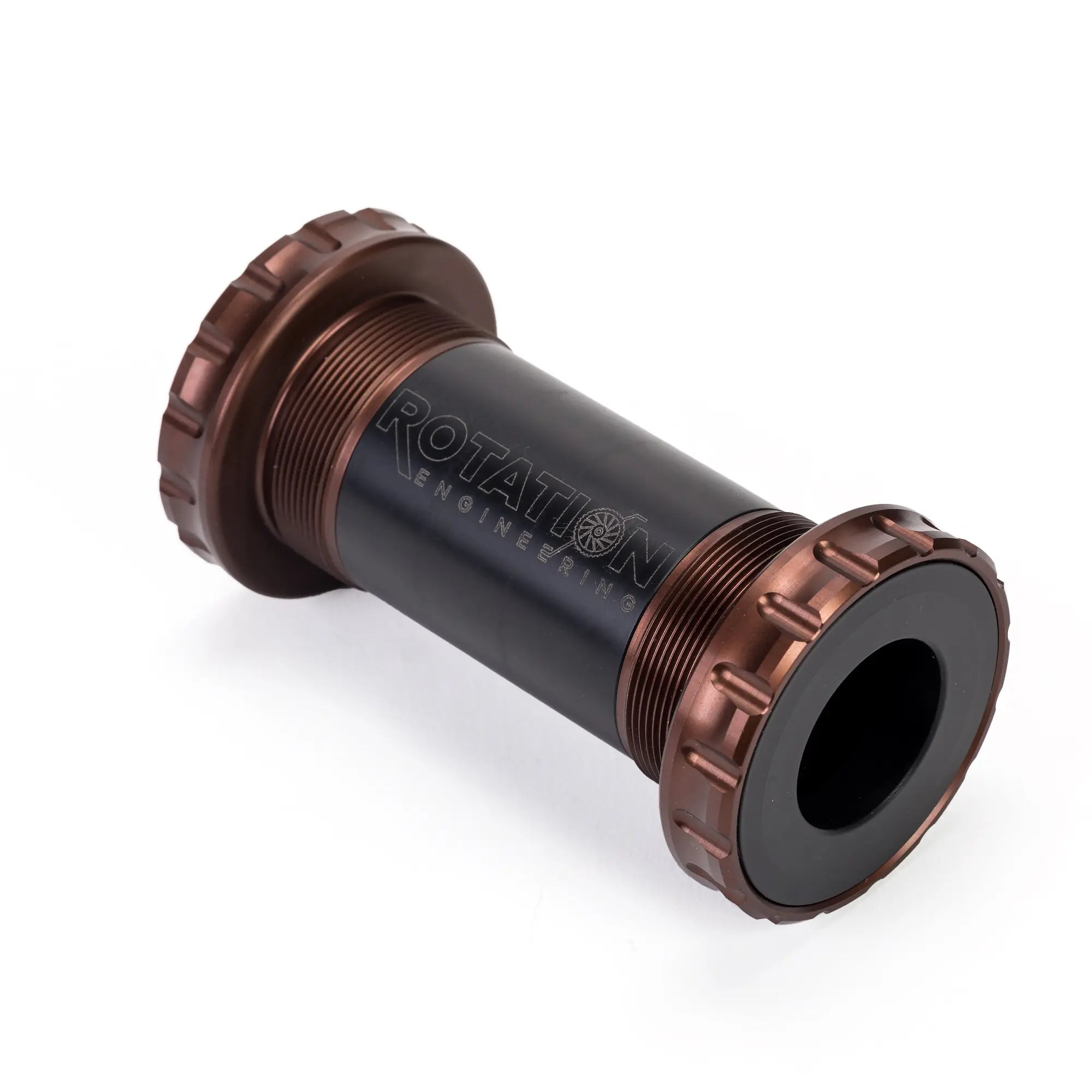 Brown and black cylindrical device labeled "Rotation Engineering," with grooved ends. Appears mechanical or industrial, conveying precision and durability.